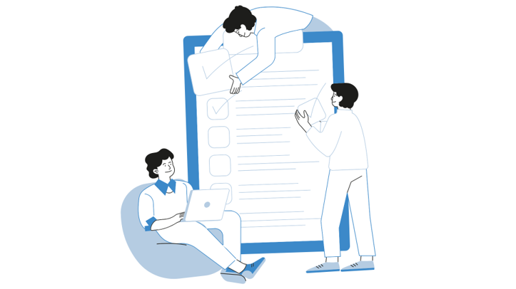 Two men talking at a computer workstation.